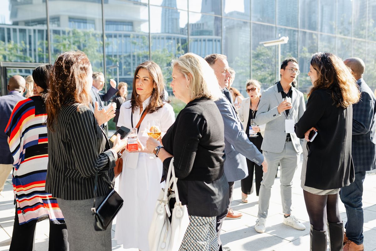 People networking on the patio at the LIEE event.