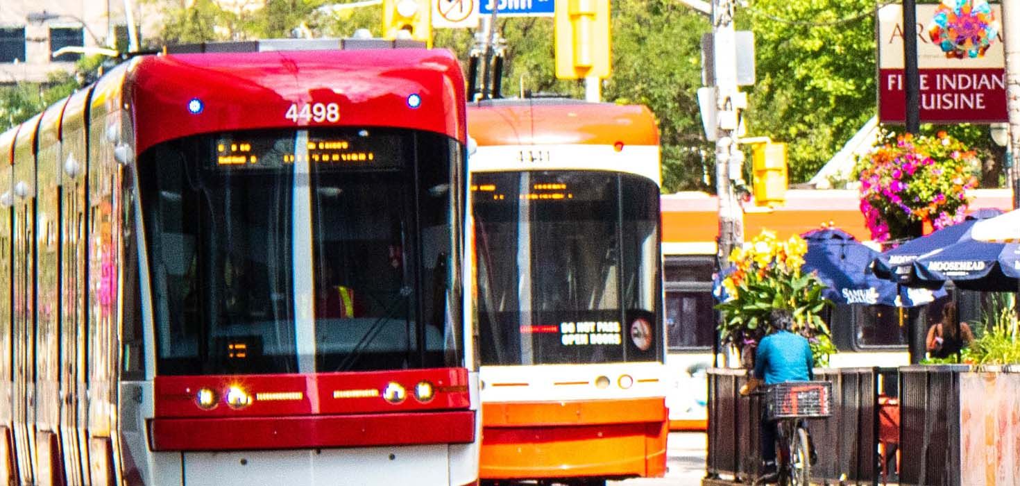 Two Toronto streetcars passing one another.
