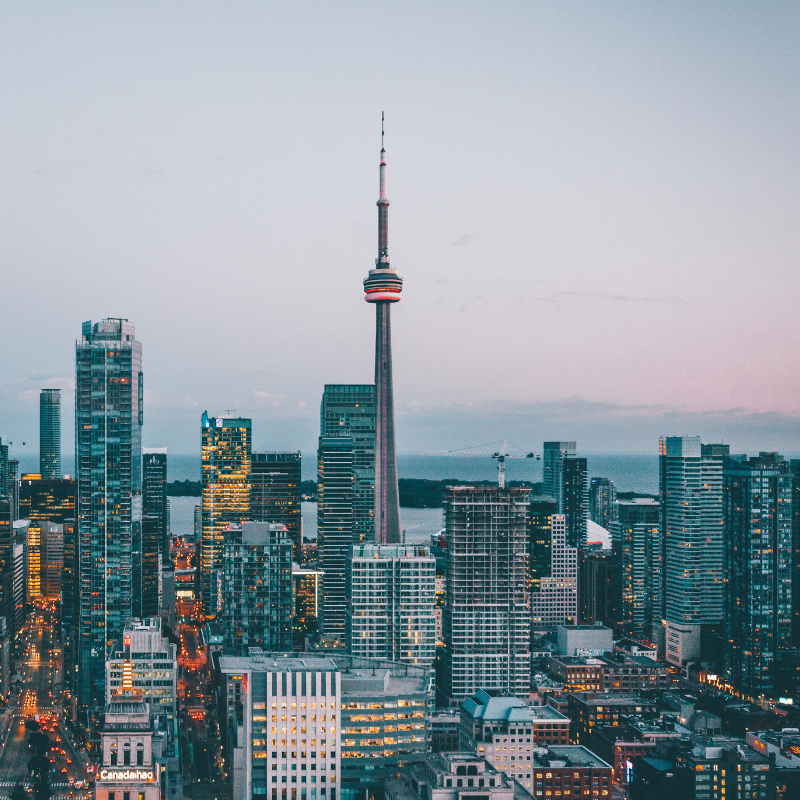 A skyline view of Toronto on a grey background.